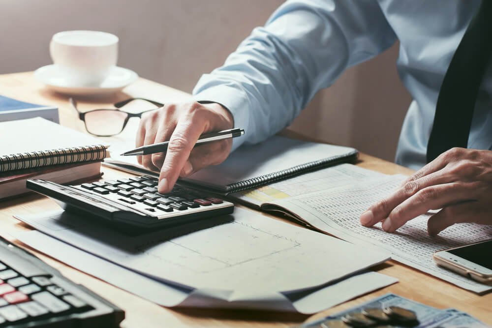 Bookkeeper using calculator